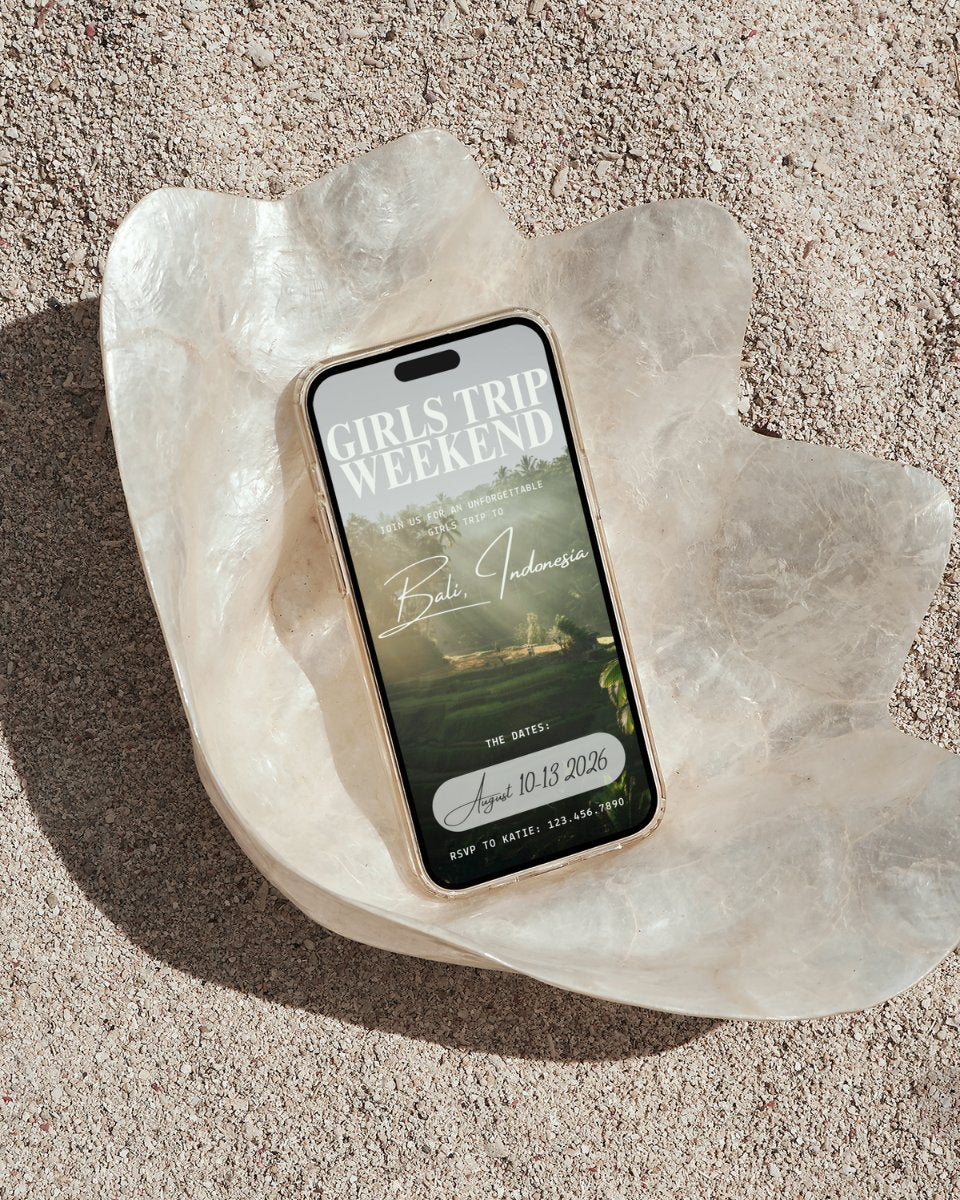 Bali Indonesia girls trip itinerary template mockup on phone in seashell on tropical beach, digital invitation, luxury canva travel planner